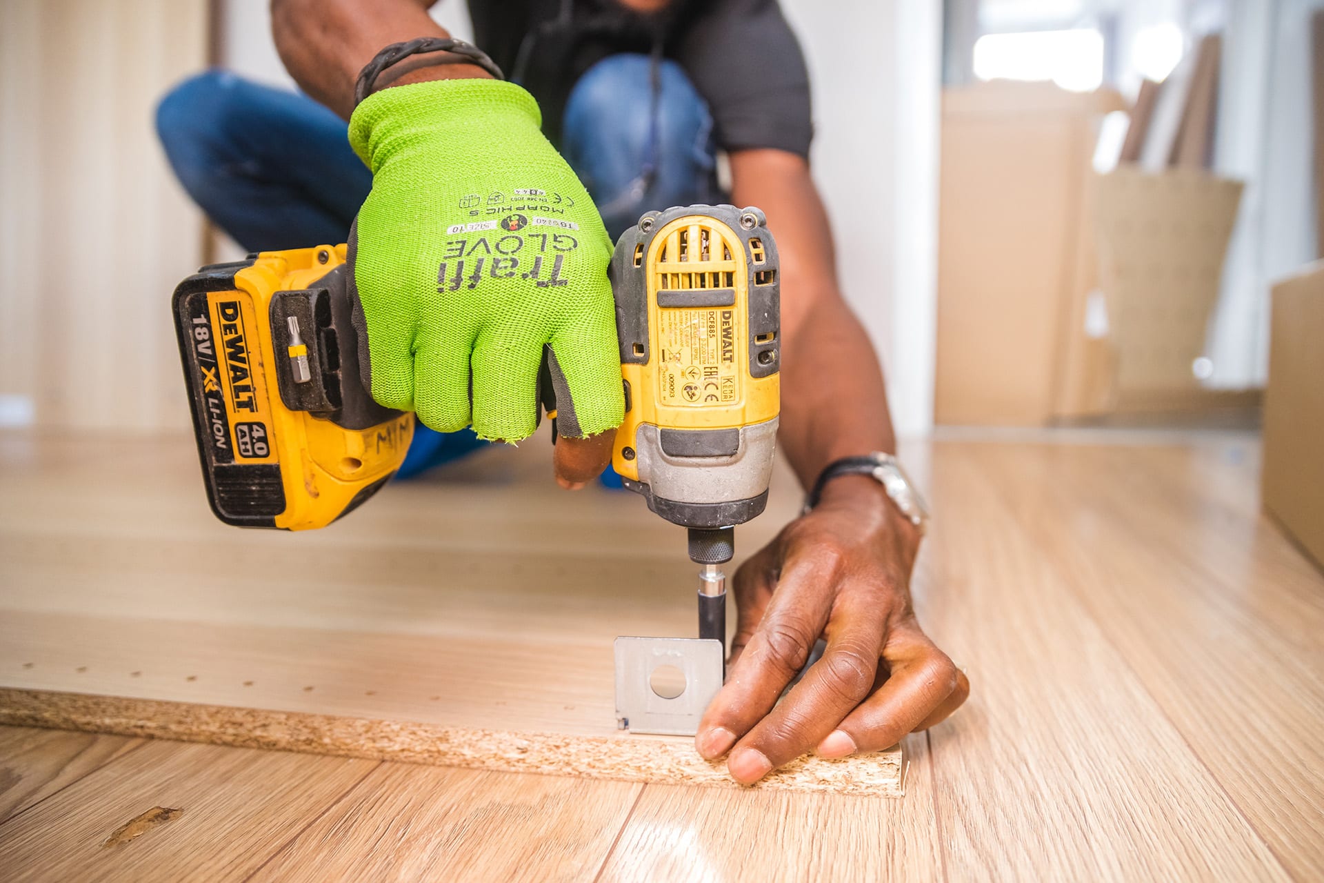 Maintenance worker using a drill on a home repair