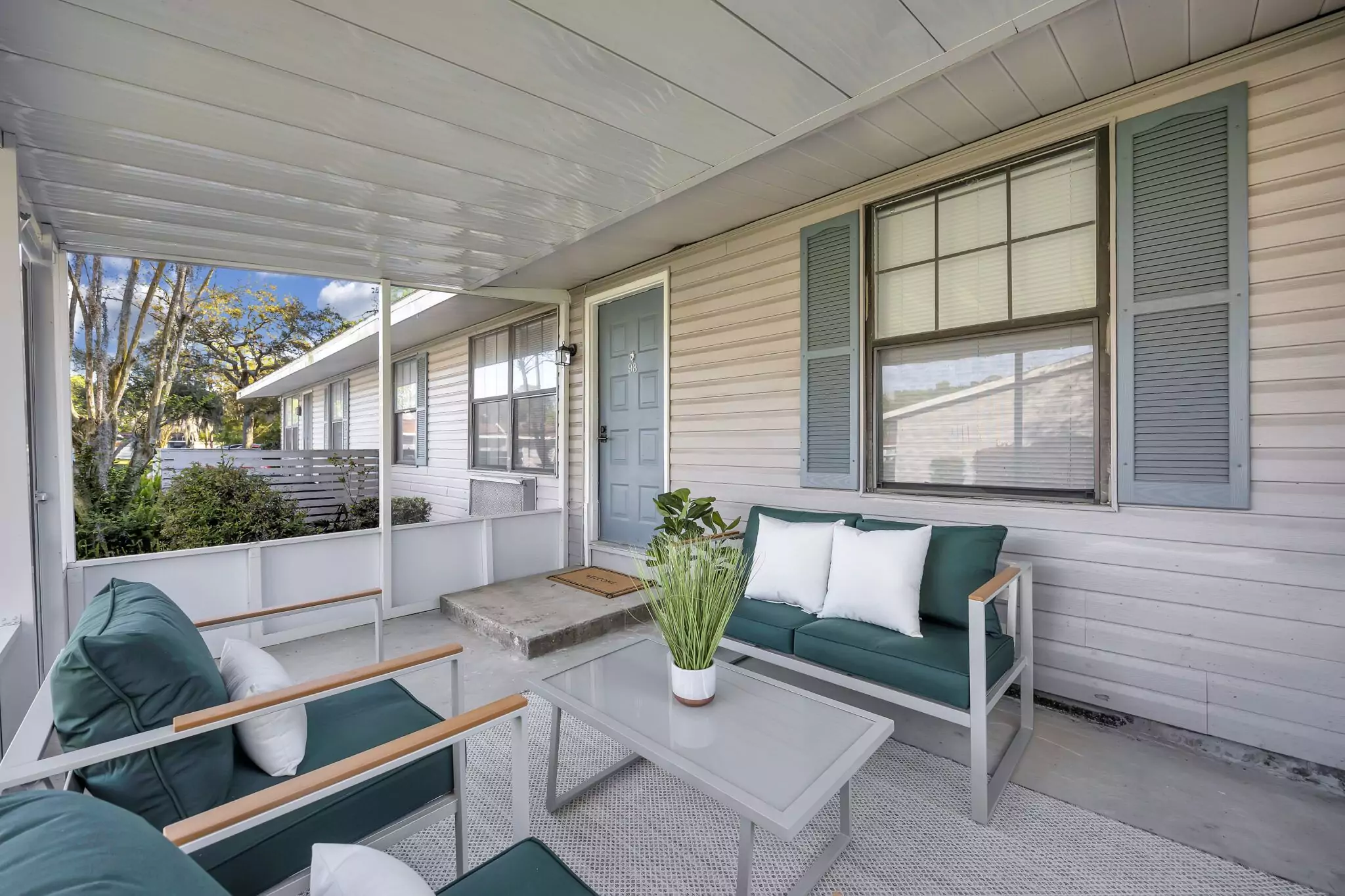 Furnished screened patio at a JaxBay apartment